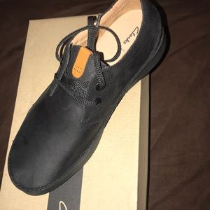 Clark’s black leather shoes